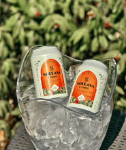 Load image into Gallery viewer, Two Sollasa and tonic cans in an ice bucket
